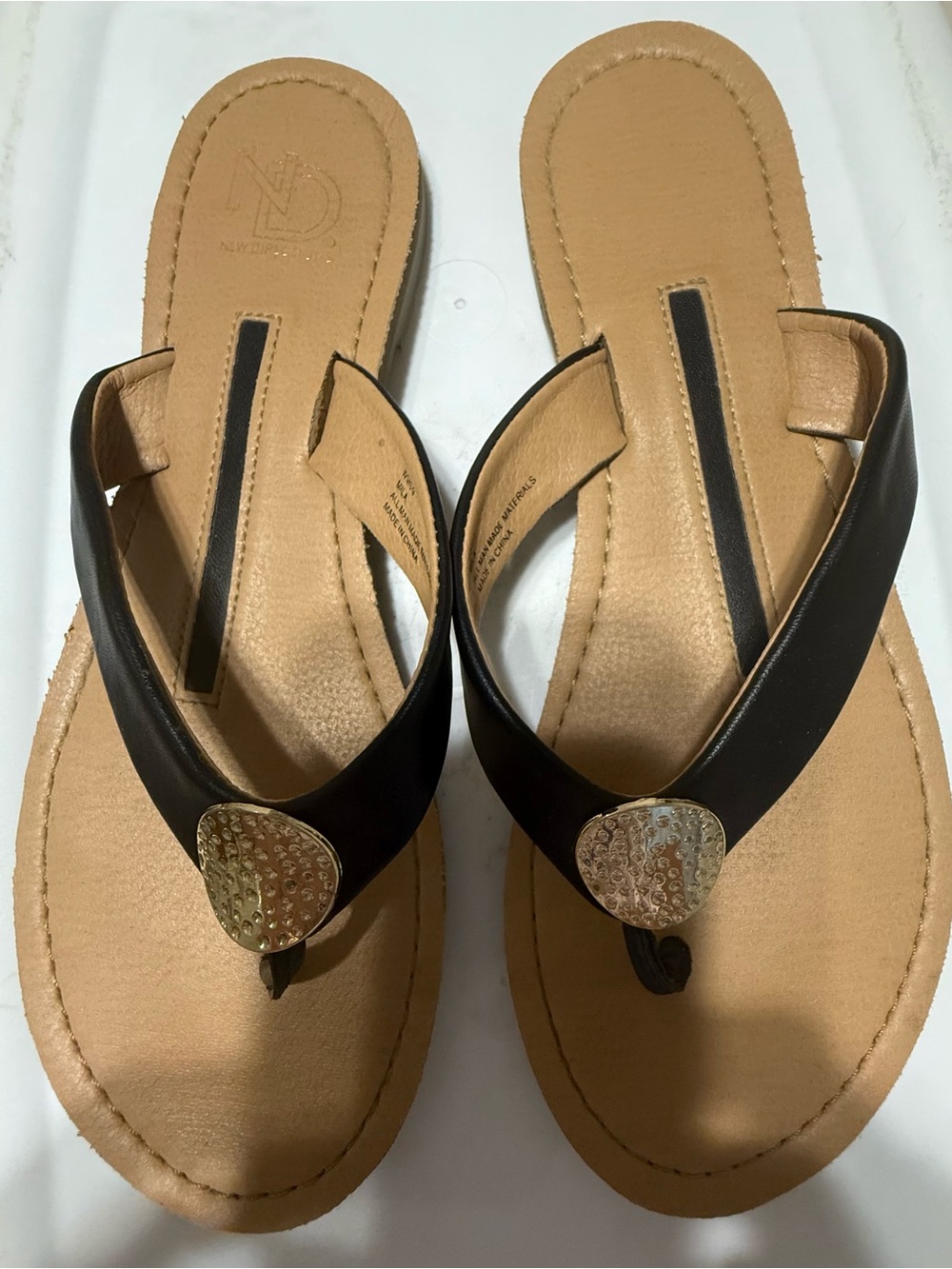 new directions Black and Tan Thong Sandals with Gold Accent
